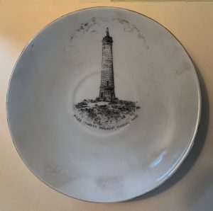 Round ceramic plate with image of the Myles Standish Monument.