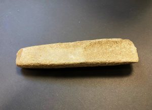 Oblong stone with center carved out, Native American tool. 